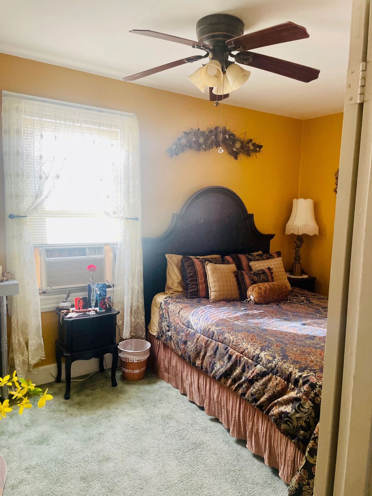Angel Suite bedroom with golden walls